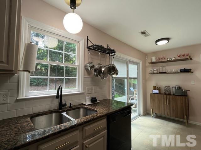 8644 Swarthmore Drive Raleigh, NC 27615 - Photo 10 of 26 a kitchen with a sink and a refrigerator