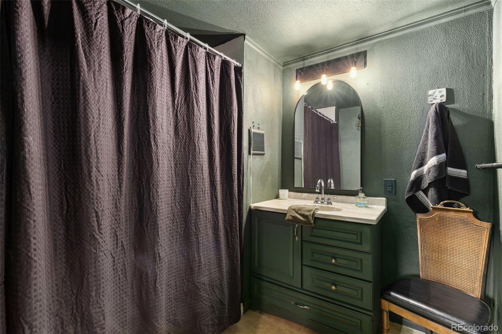230 North 2nd Street Berthoud, CO 80513 - Photo 13 of 15 a bathroom with a double vanity sink and a mirror