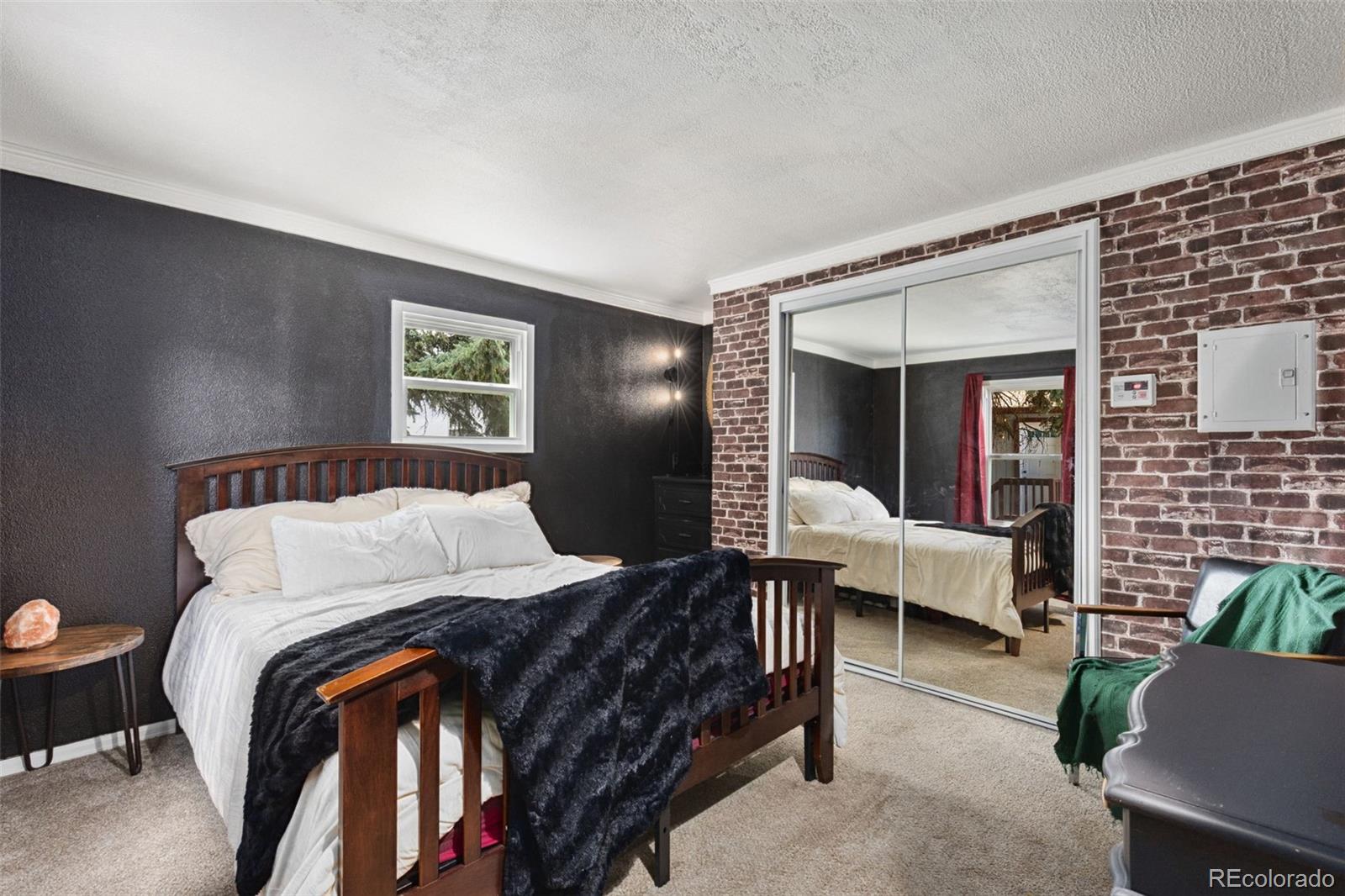 230 North 2nd Street Berthoud, CO 80513 - Photo 14 of 15 a bedroom with bed and window