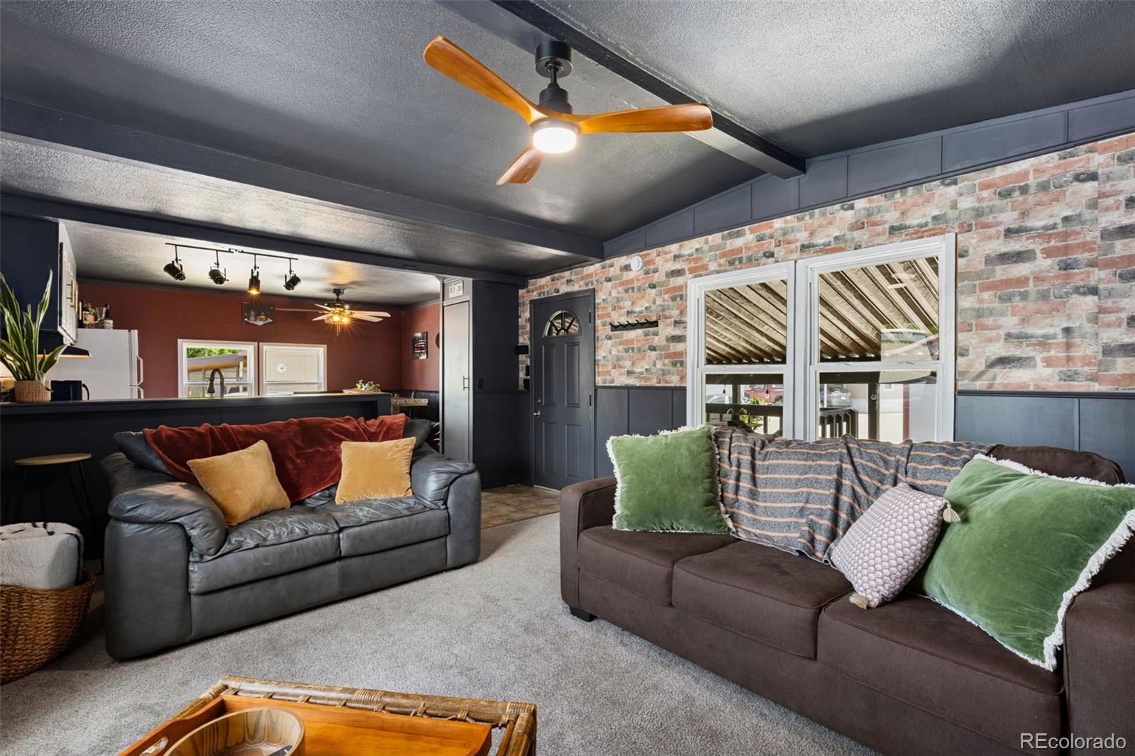 230 North 2nd Street Berthoud, CO 80513 - Photo 3 of 15 a living room with furniture and a ceiling fan