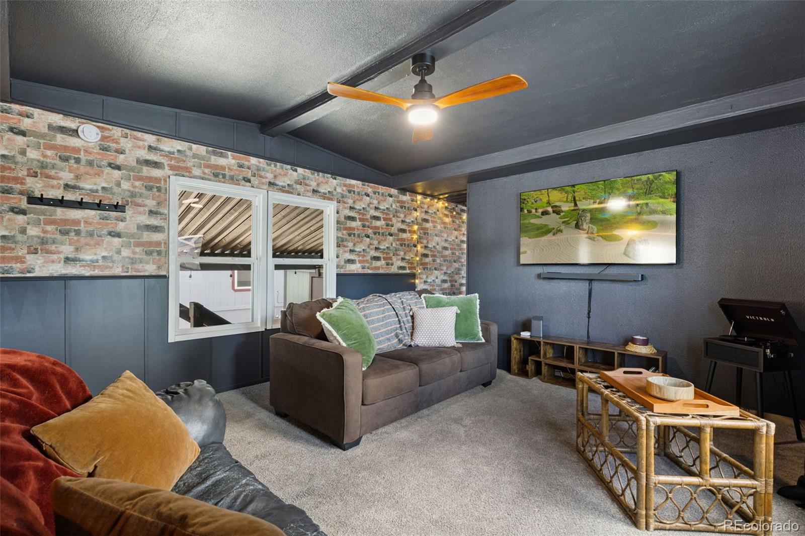 230 North 2nd Street Berthoud, CO 80513 - Photo 4 of 15 a living room with furniture and a flat screen tv