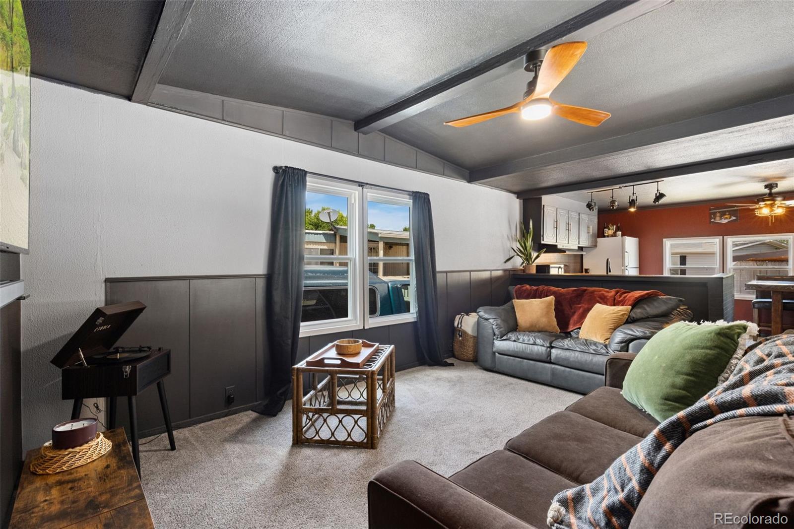 230 North 2nd Street Berthoud, CO 80513 - Photo 5 of 15 a living room with furniture and a flat screen tv