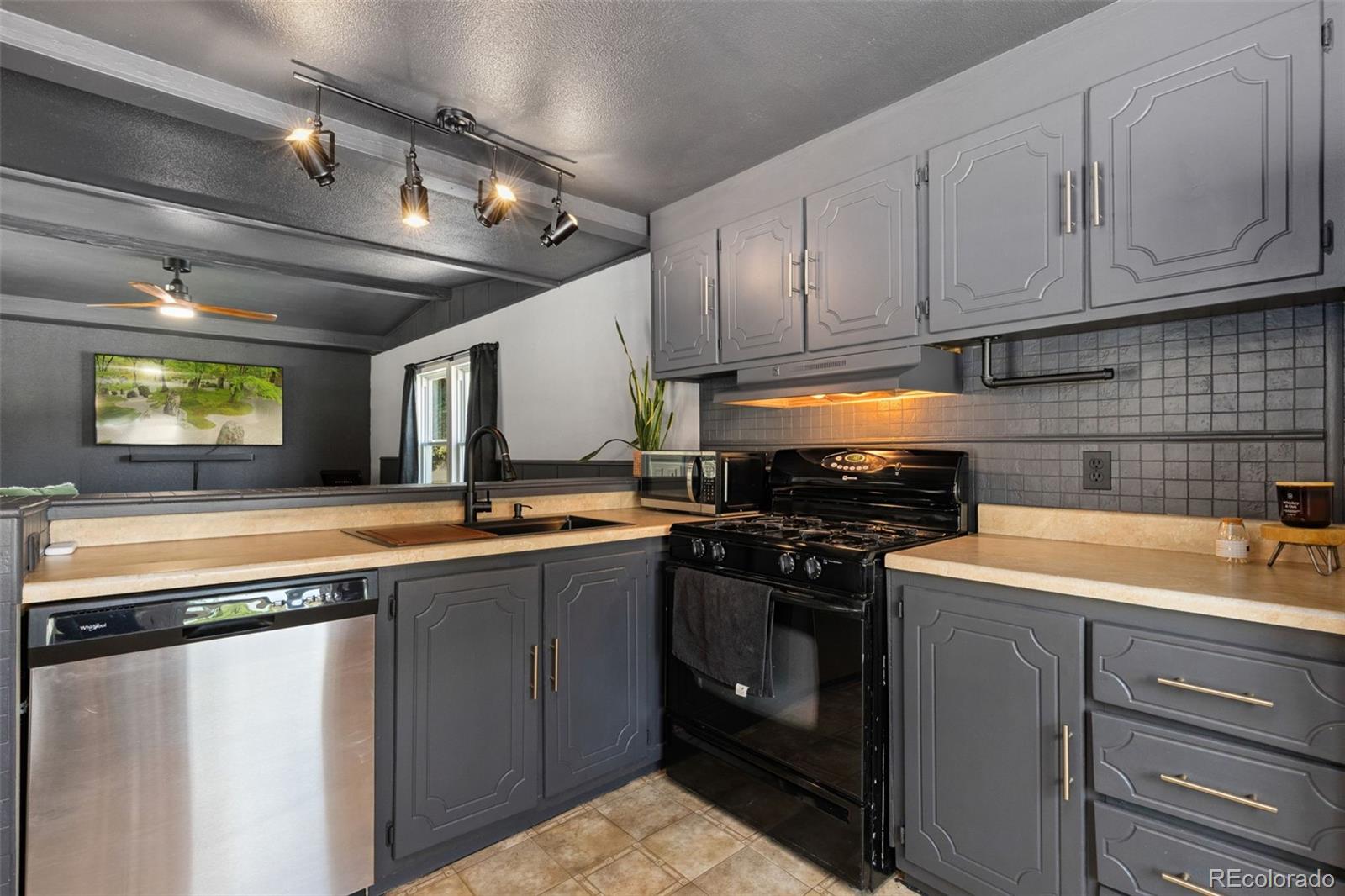 230 North 2nd Street Berthoud, CO 80513 - Photo 8 of 15 a kitchen with a sink and cabinets
