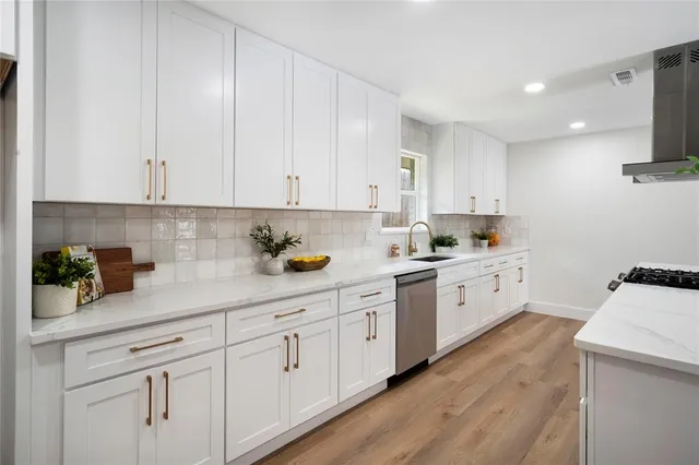 a bedroom with furniture or couch and a potted plant
