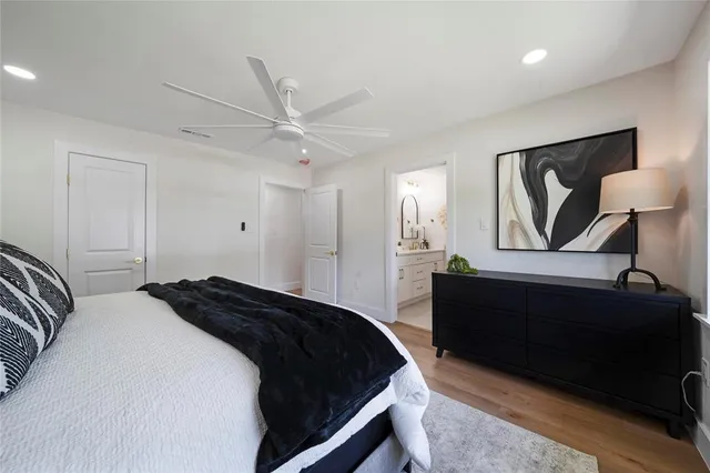 a bathroom with a double vanity sink mirror and toilet