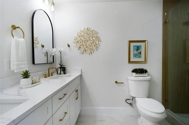 a bathroom with a tub shower and sink