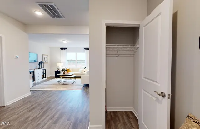 a view of a kitchen and wooden floor