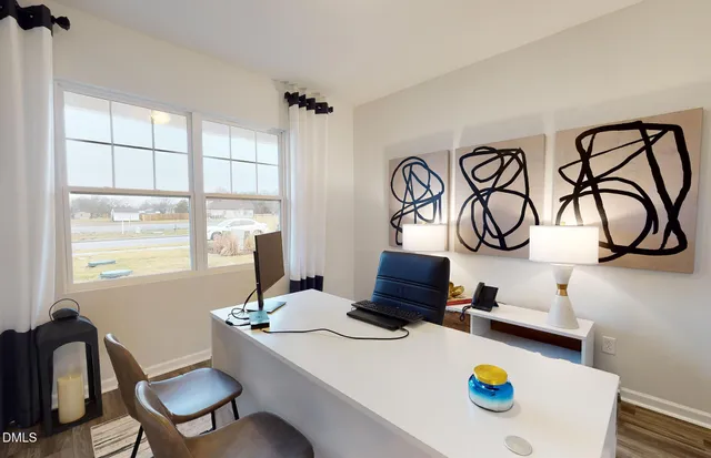 a view of a kitchen with a stove a table and chairs