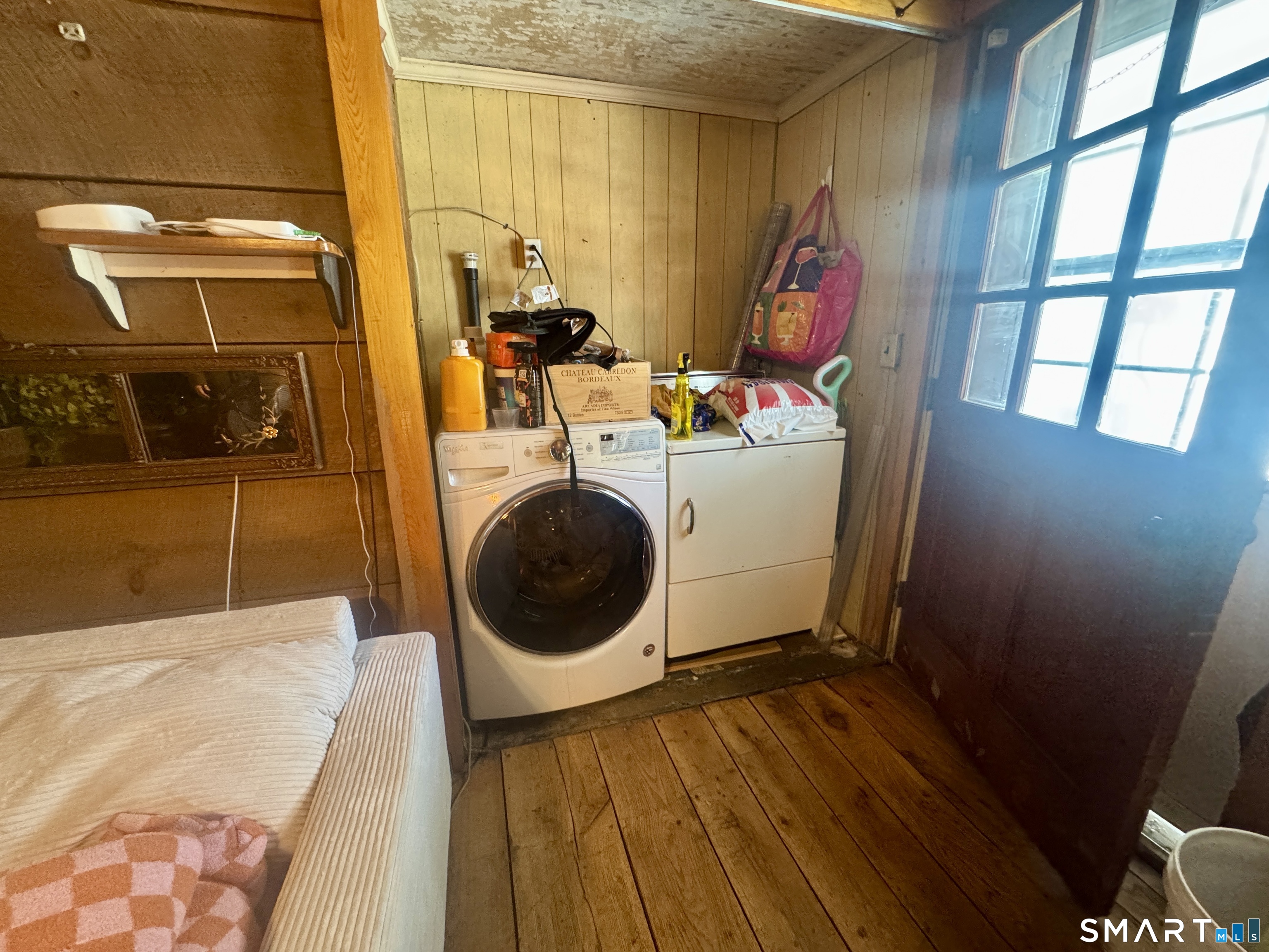 279 Putnam Pike Killingly, CT 06241 - Photo 20 of 39 a room with wooden floor and utility room