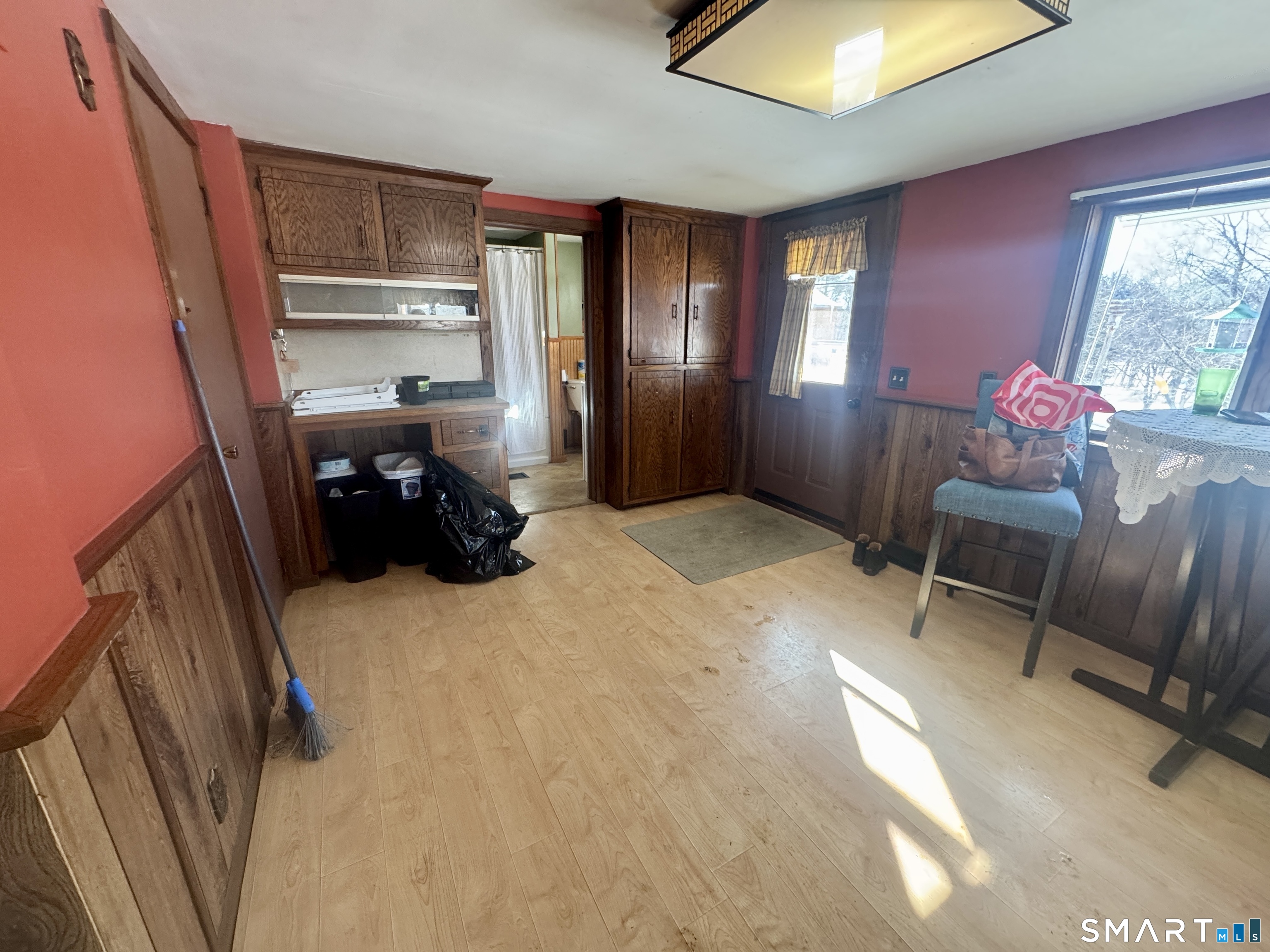 279 Putnam Pike Killingly, CT 06241 - Photo 2 of 39 a bed room with a bed and a chair