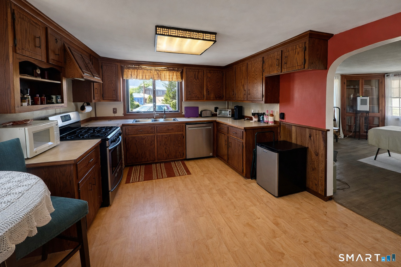 279 Putnam Pike Killingly, CT 06241 - Photo 29 of 39 a kitchen with stainless steel appliances kitchen island granite countertop a stove refrigerator and cabinets