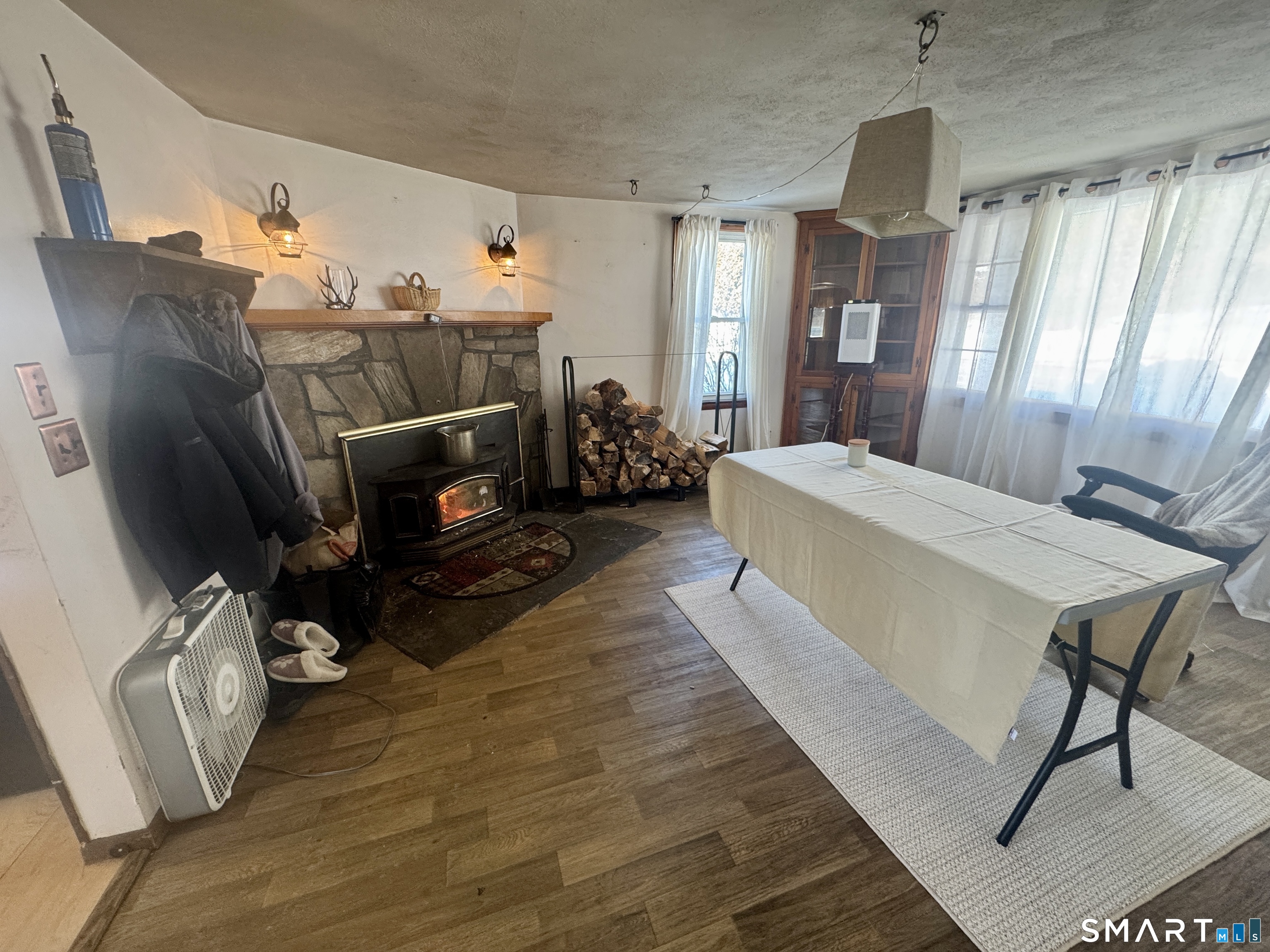 279 Putnam Pike Killingly, CT 06241 - Photo 4 of 39 a living room with furniture and a fireplace