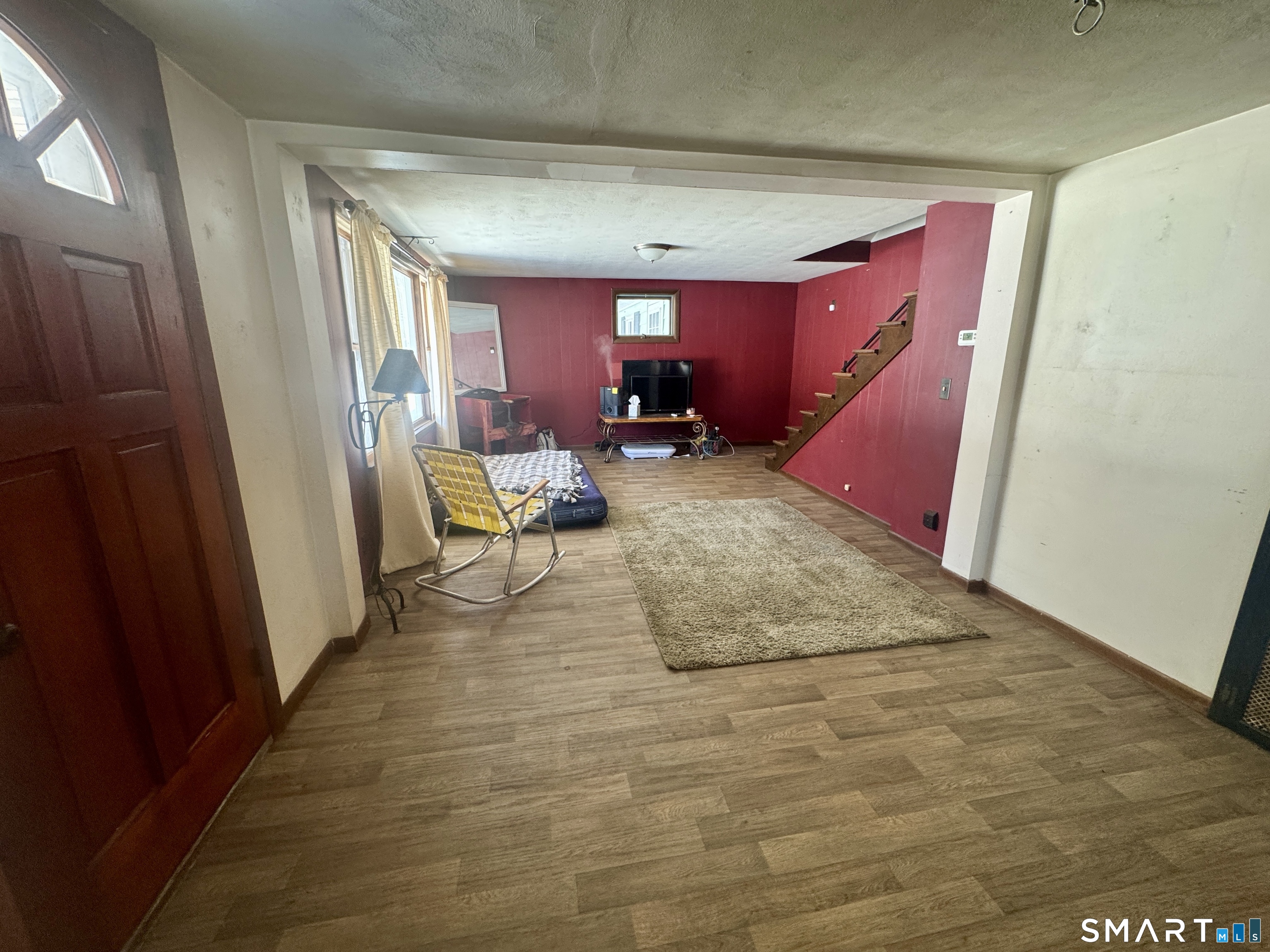 279 Putnam Pike Killingly, CT 06241 - Photo 5 of 39 a view of a livingroom with furniture and staircase