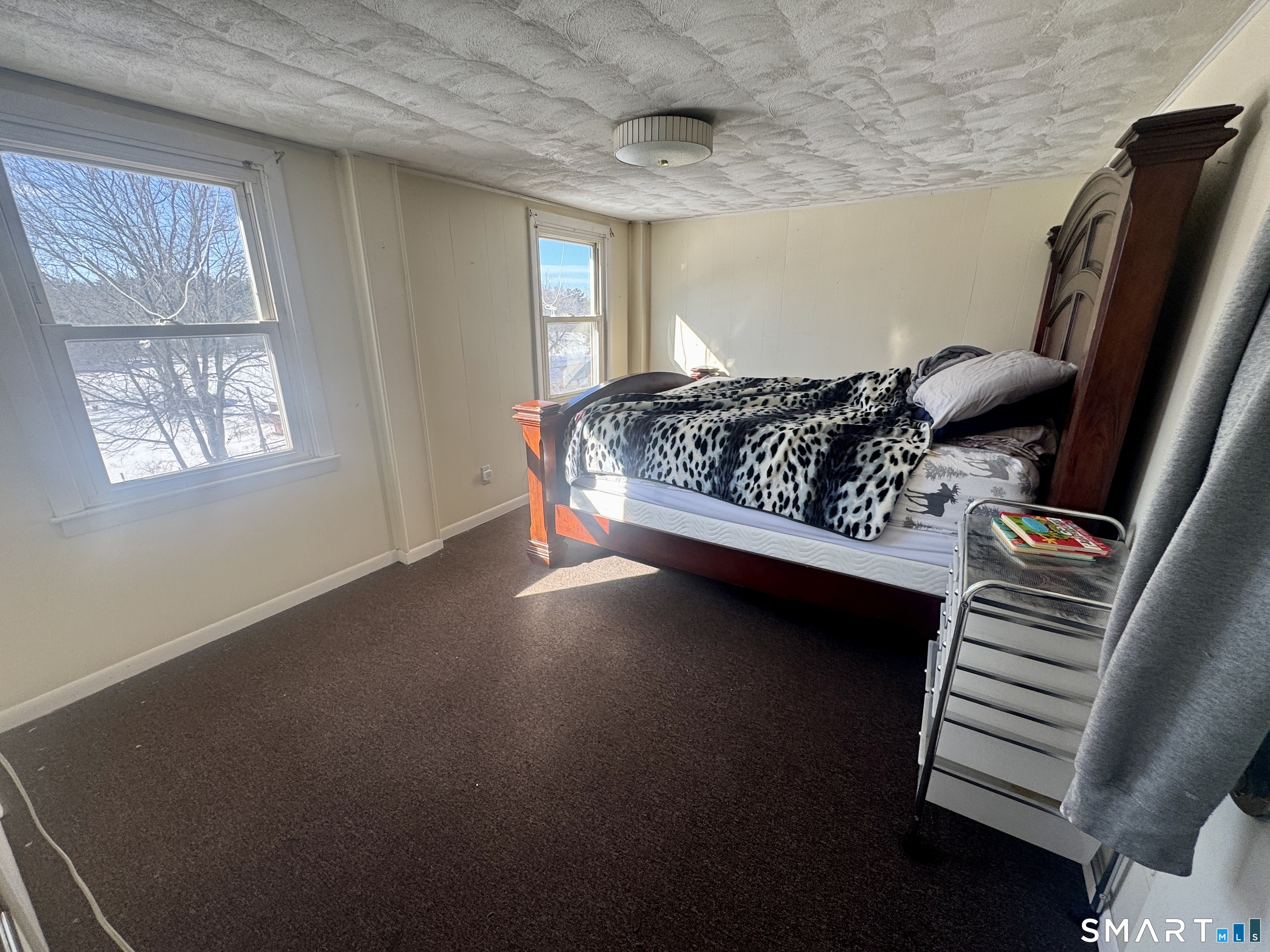 279 Putnam Pike Killingly, CT 06241 - Photo 7 of 39 a bed sitting in a bedroom next to a window