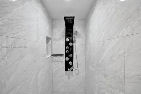 a bedroom with a bed and dresser