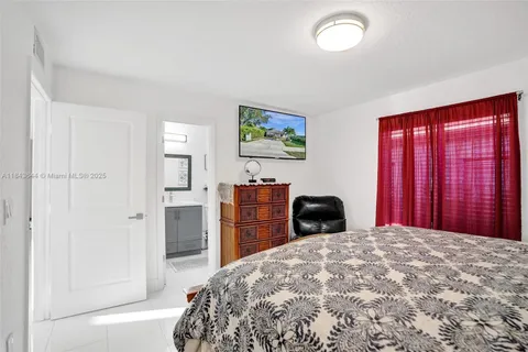 a bedroom with a bed and cabinets