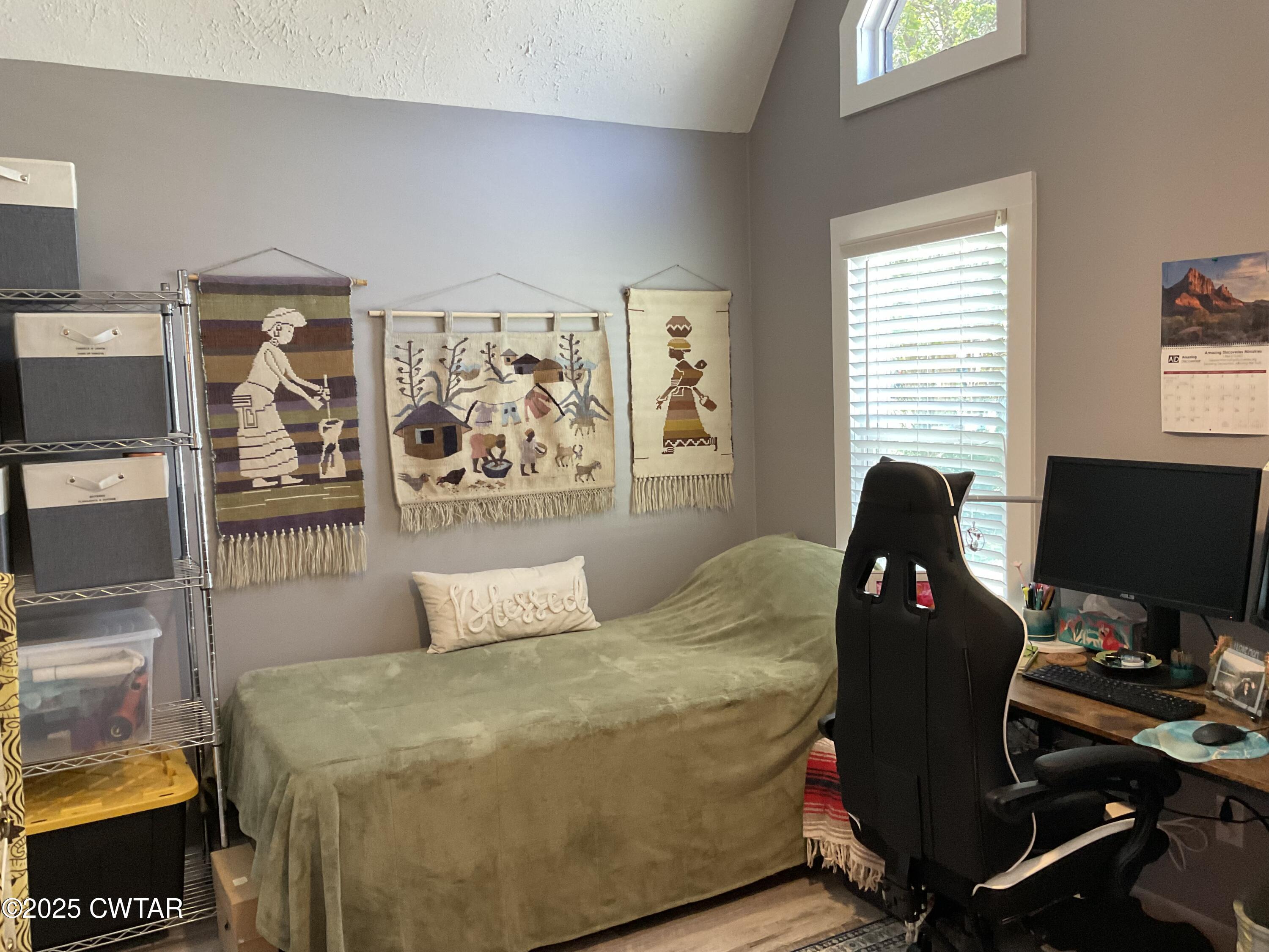 28 Beaver Cove Jackson, TN 38305 - Photo 14 of 18 a bedroom with a bed and wooden floor