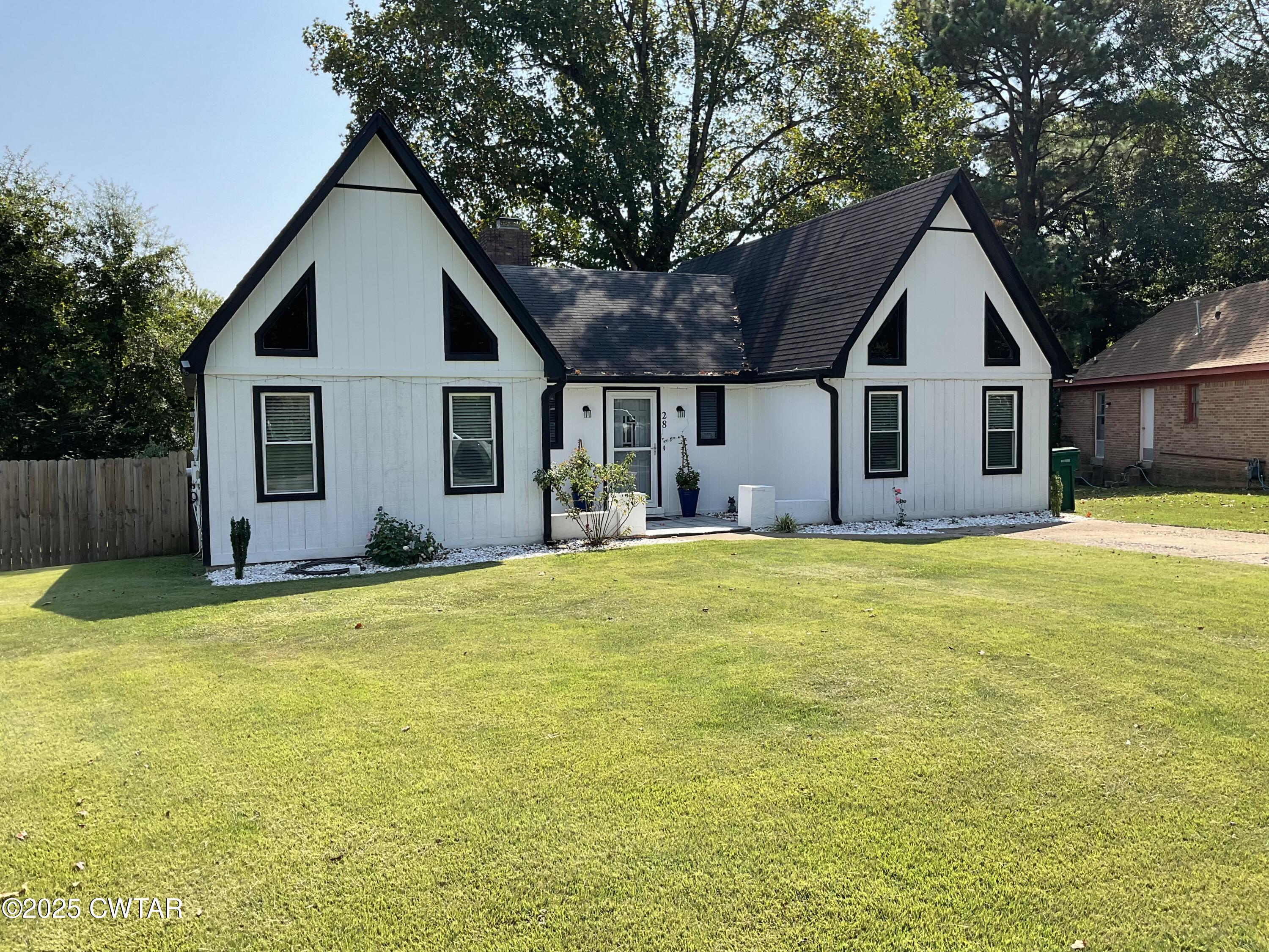28 Beaver Cove Jackson, TN 38305 - Photo 2 of 18 a house view with swimming pool in front of it
