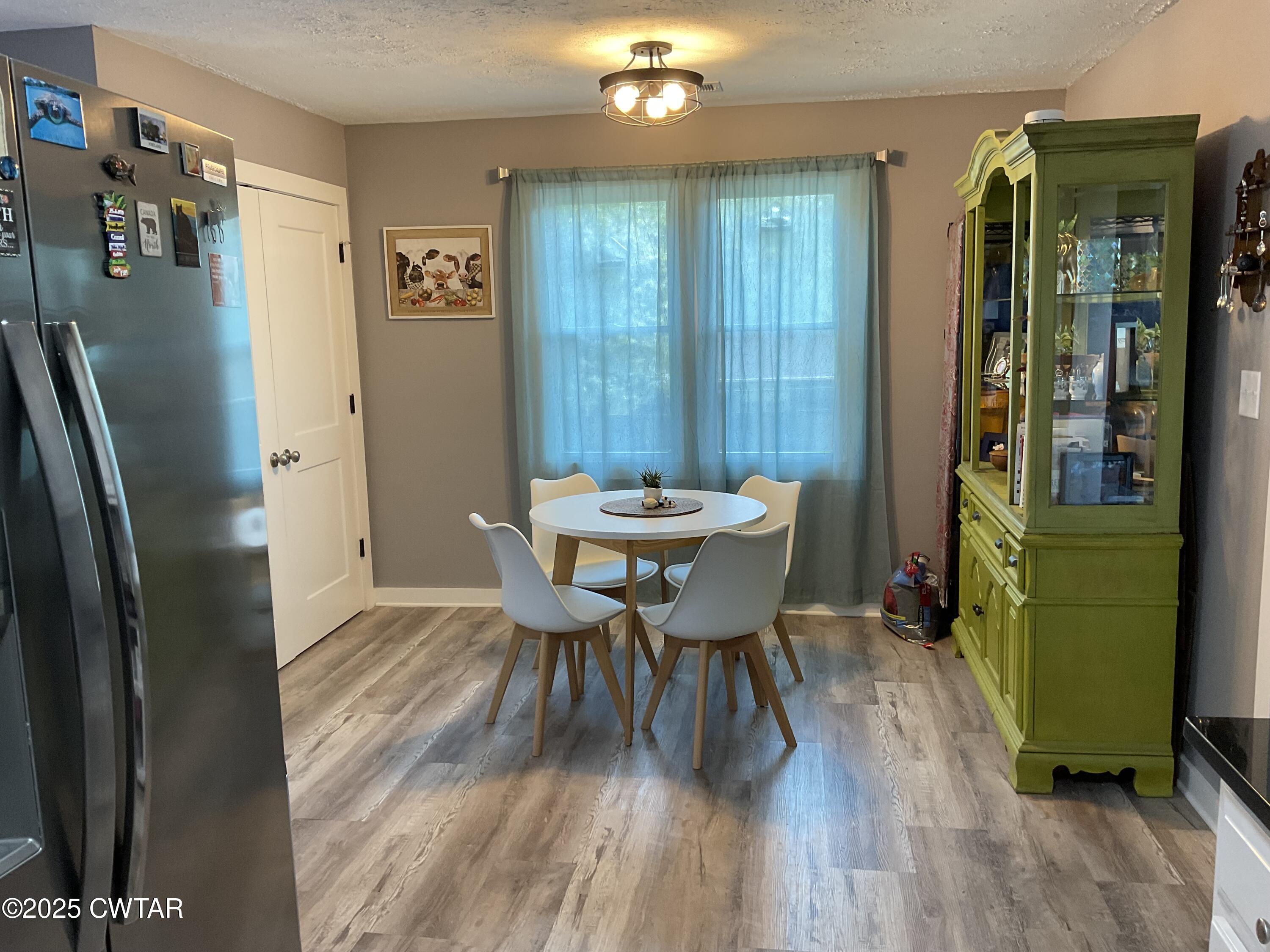 28 Beaver Cove Jackson, TN 38305 - Photo 7 of 18 a view of a dining room with furniture and wooden floor