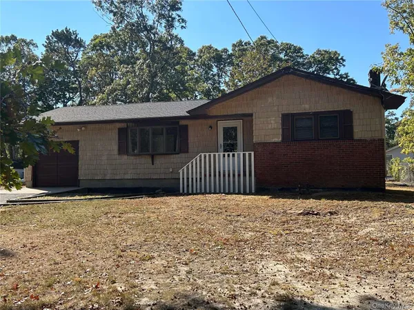 a house with trees in the background