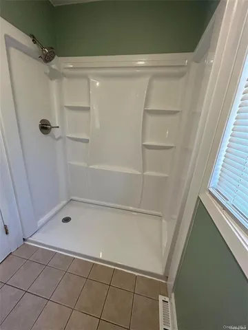 a bathroom with a bath tub