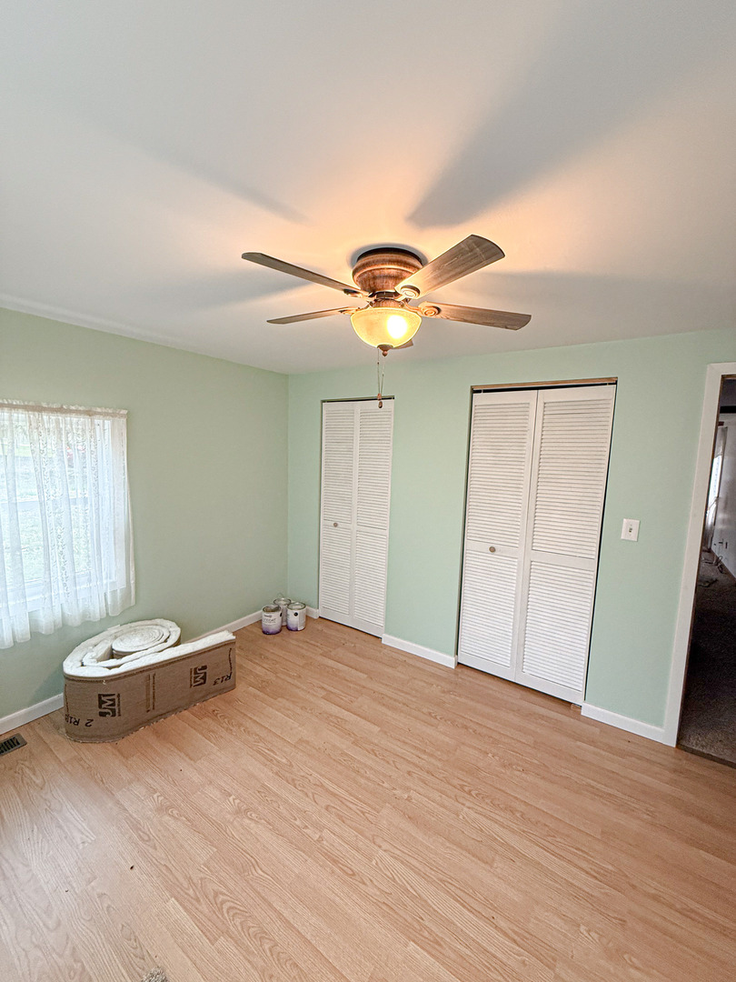 1599 East 2700 North Road Clifton, IL 60927 - Photo 24 of 26 a bedroom with a bed and a window