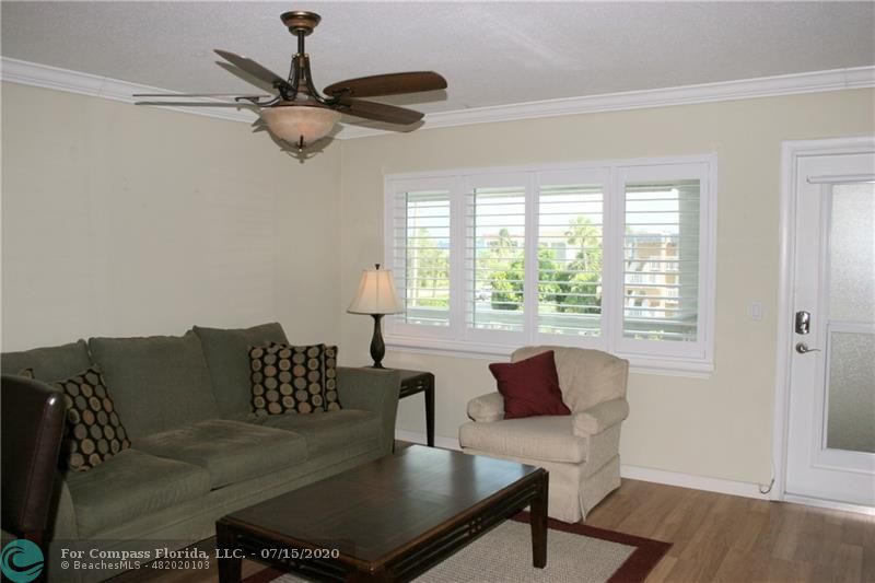 Living room with view through the plantation shutters.