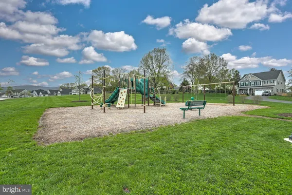 a view of a yard with an outdoor seating