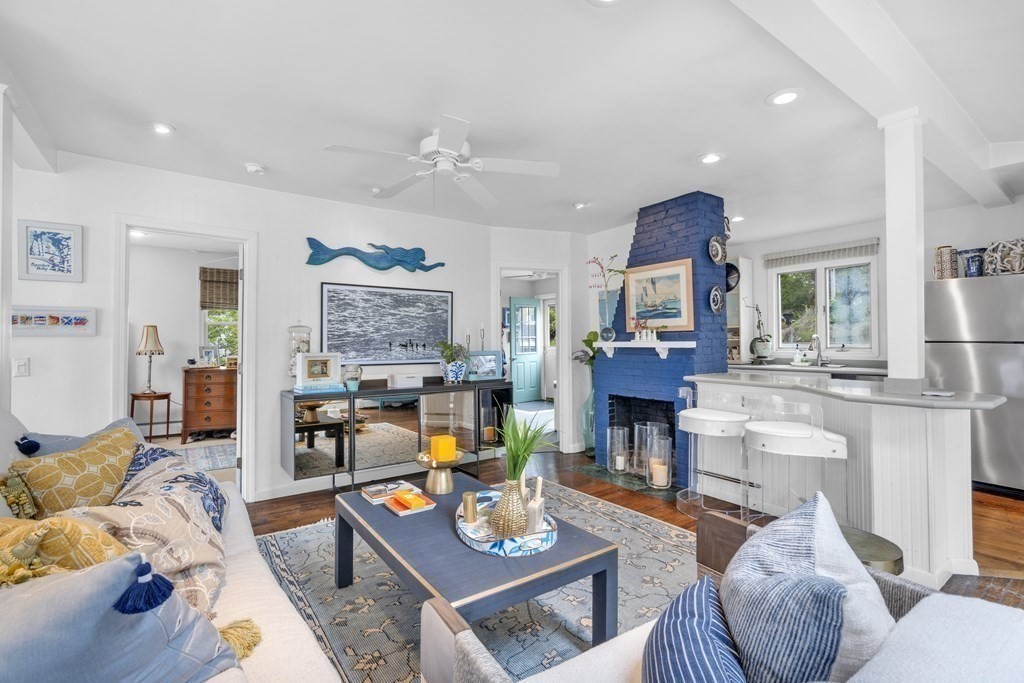 94 Pitman Road Marblehead, MA 01945 - Photo 18 of 35 a living room with fireplace furniture and a wooden floor