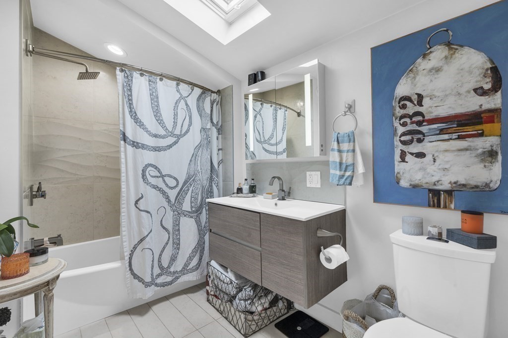 94 Pitman Road Marblehead, MA 01945 - Photo 20 of 35 a bathroom with a sink a mirror and a shower