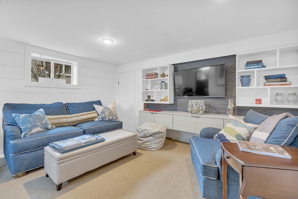 94 Pitman Road Marblehead, MA 01945 - Photo 25 of 35 a living room with furniture and a flat screen tv