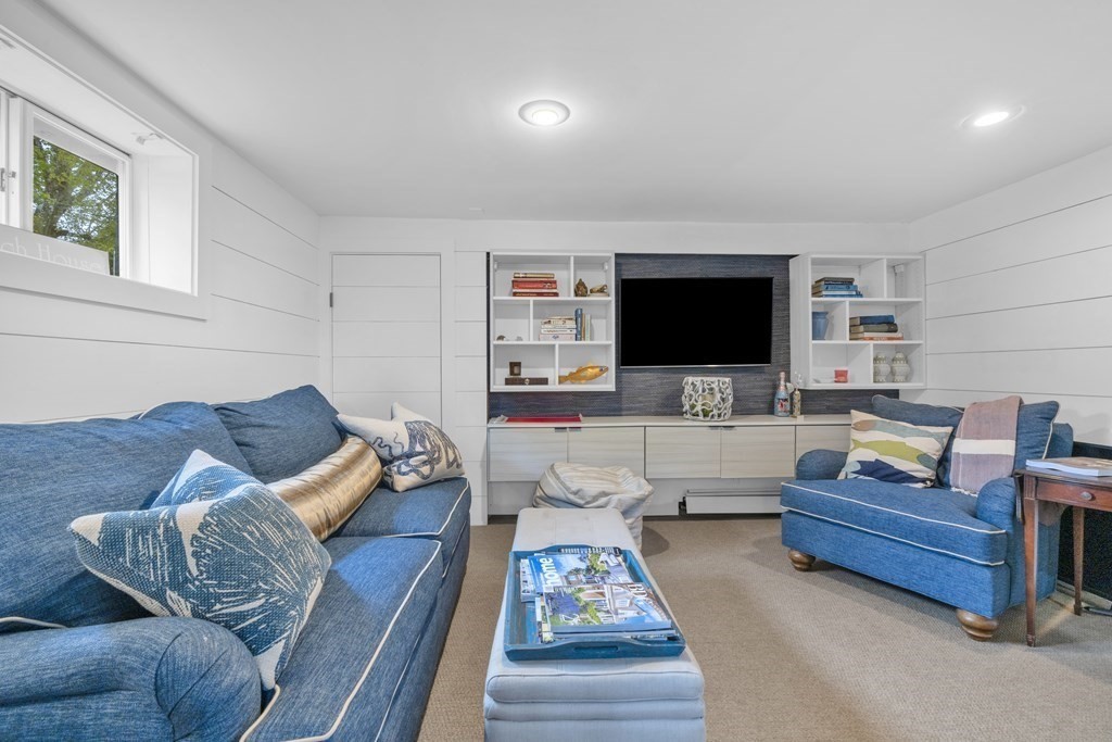 94 Pitman Road Marblehead, MA 01945 - Photo 26 of 35 a living room with furniture and a flat screen tv