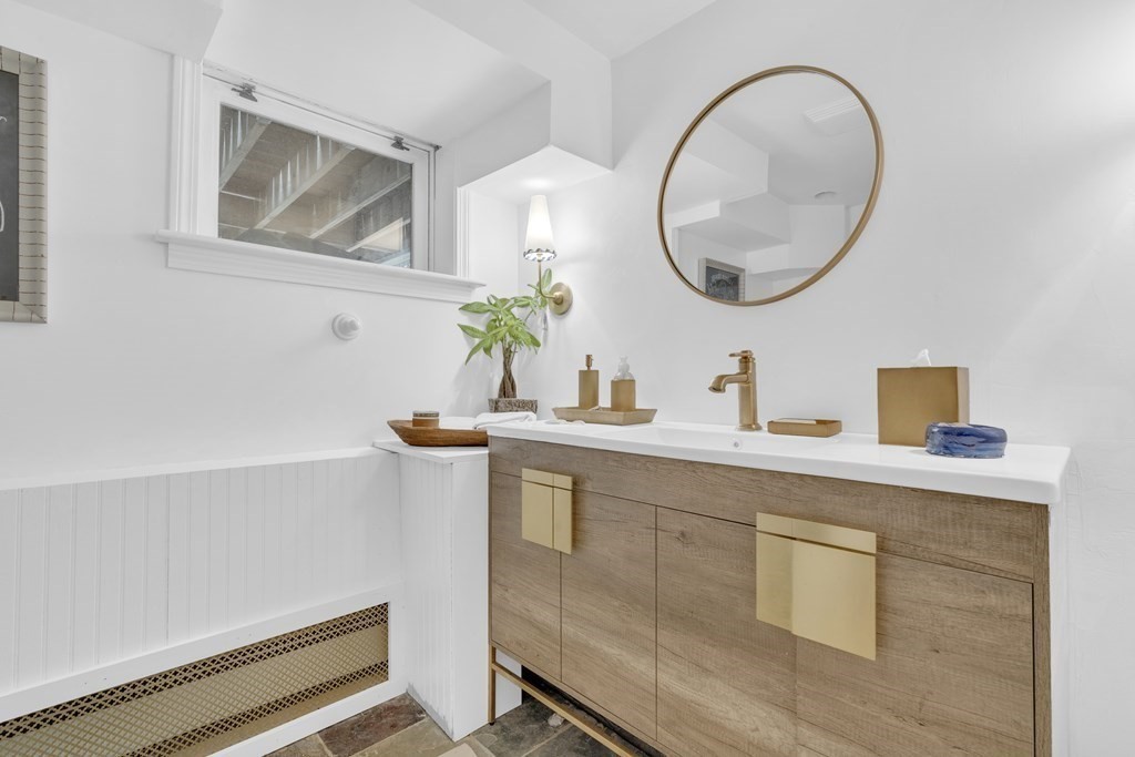 94 Pitman Road Marblehead, MA 01945 - Photo 30 of 35 a bathroom with a sink mirror and vanity
