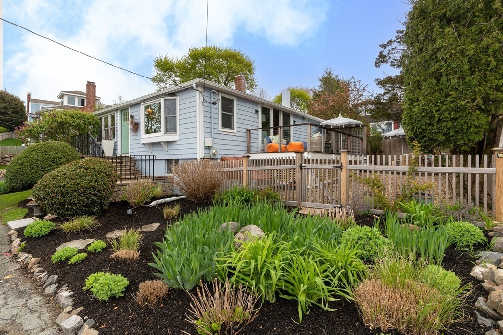94 Pitman Road Marblehead, MA 01945 - Photo 33 of 35 a backyard of a house with a garden and plants