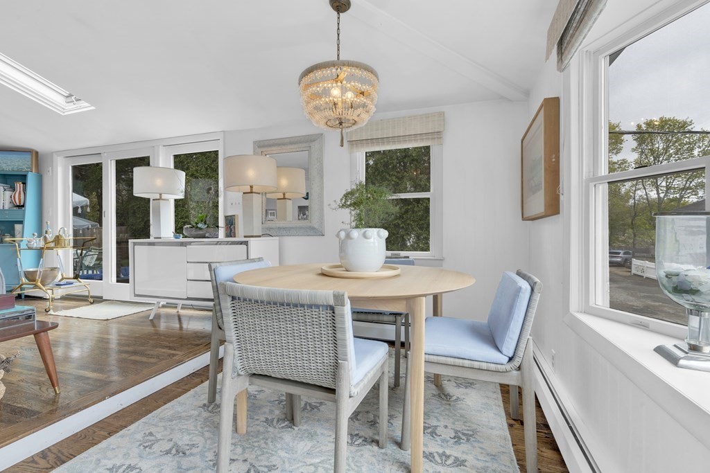 94 Pitman Road Marblehead, MA 01945 - Photo 5 of 35 a view of a dining room with furniture wooden floor and a chandelier