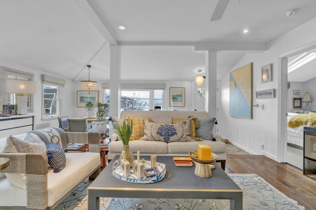 94 Pitman Road Marblehead, MA 01945 - Photo 6 of 35 a living room with furniture and a dining table with wooden floor