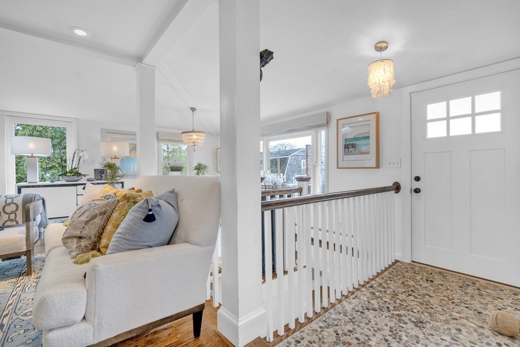 94 Pitman Road Marblehead, MA 01945 - Photo 8 of 35 a living room with furniture and a chandelier