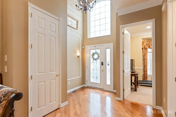 a large spacious bathroom with a tub sink and mirror