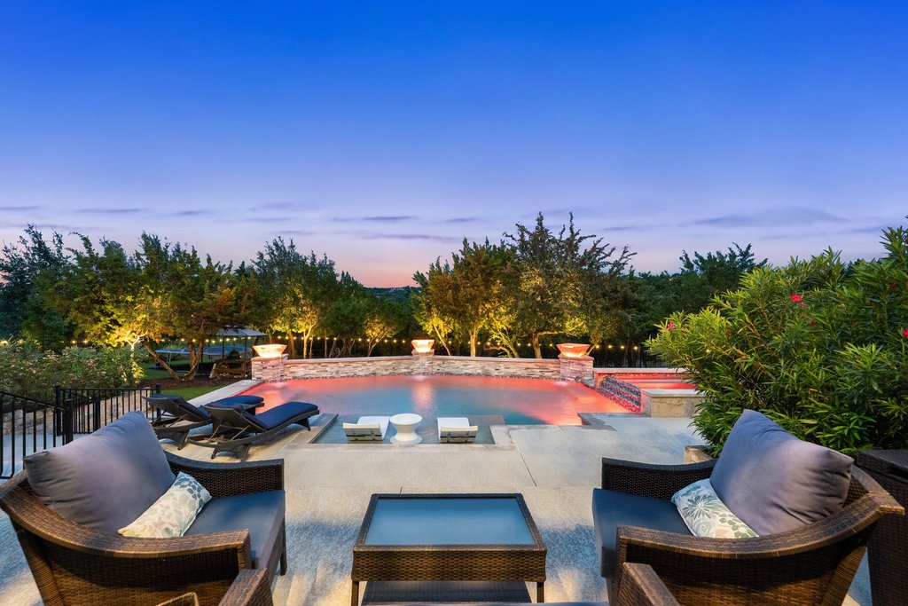 215 Lodestone Lane Austin, TX 78738 - Photo 1 of 40 Your backyard oasis awaits with a captivating pool and spa and serene views!