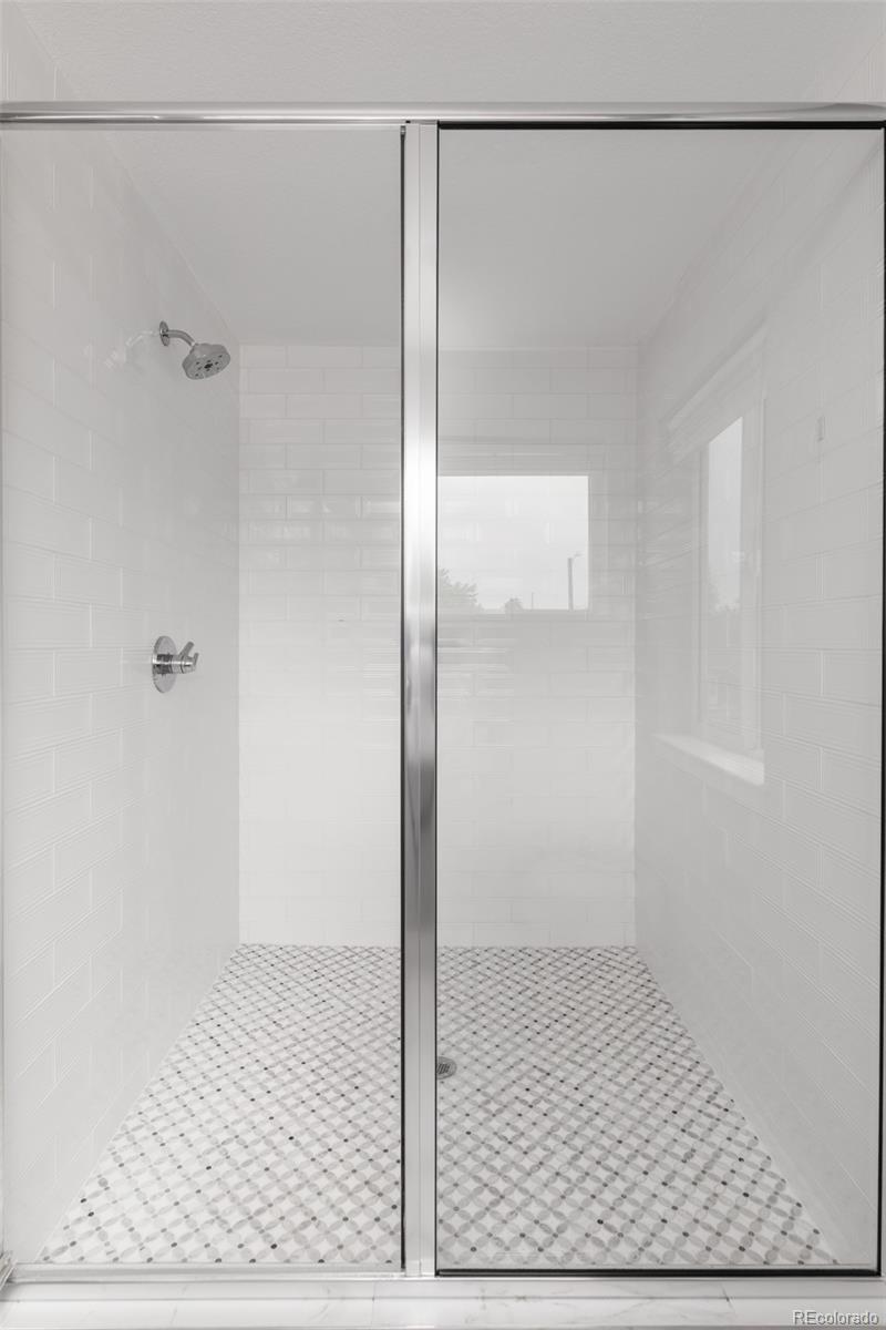 5230 Stuart Street Denver, CO 80212 - Photo 20 of 34 a bathroom with a shower