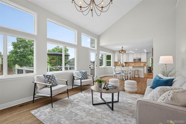 a living room with furniture and a table