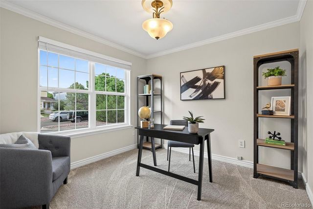 a view of a livingroom with furniture and window