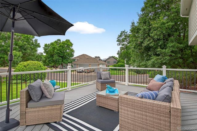 a view of a chair and tables the patio