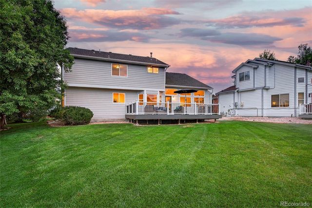 a view of a house with a backyard