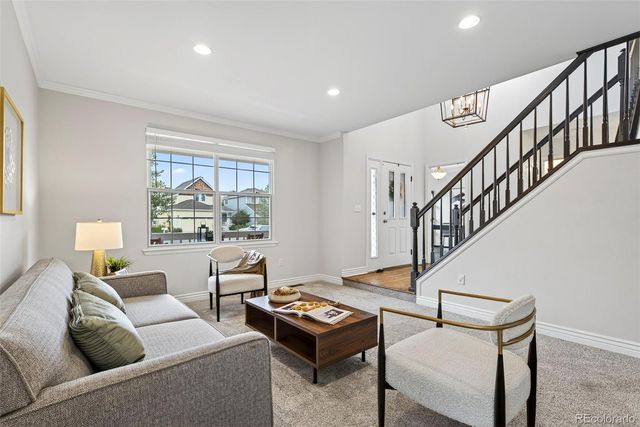 a living room with furniture and a table