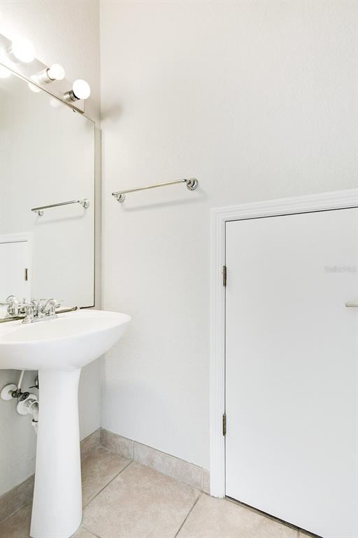 3466 Allegra Circle St. Cloud, FL 34772 - Photo 11 of 29 a bathroom with a sink and shower