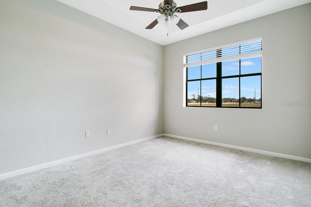 3466 Allegra Circle St. Cloud, FL 34772 - Photo 15 of 29 an empty room with windows and fan