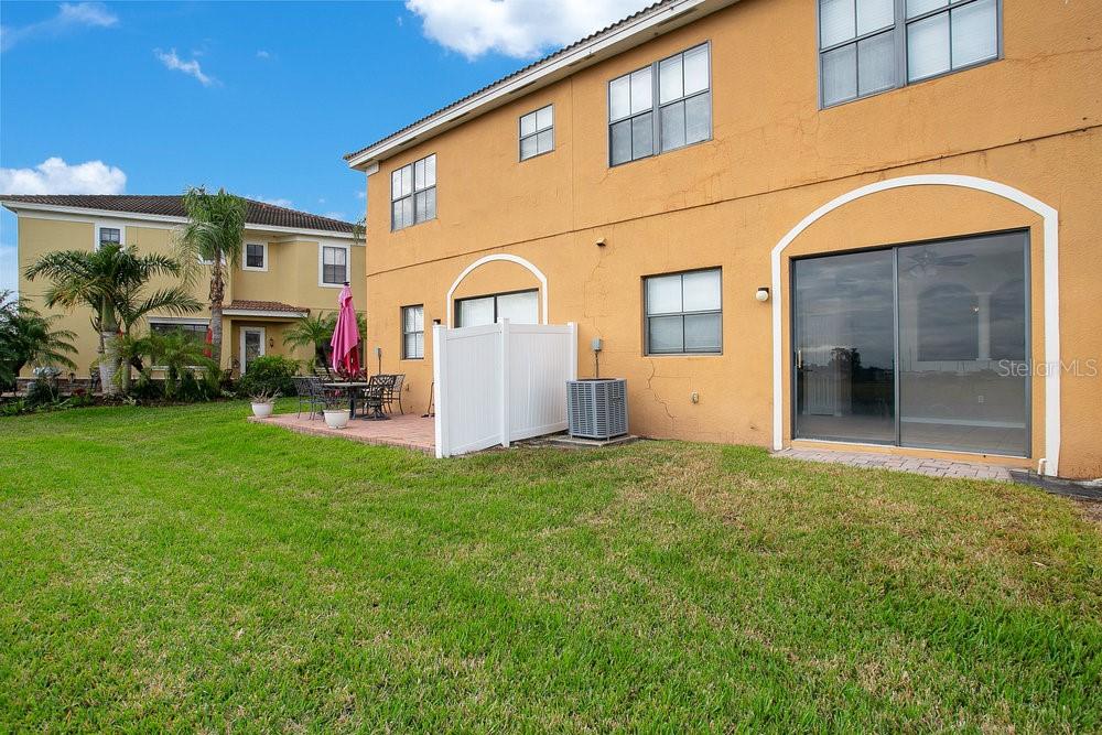 3466 Allegra Circle St. Cloud, FL 34772 - Photo 22 of 29 a view of a house with backyard and garden
