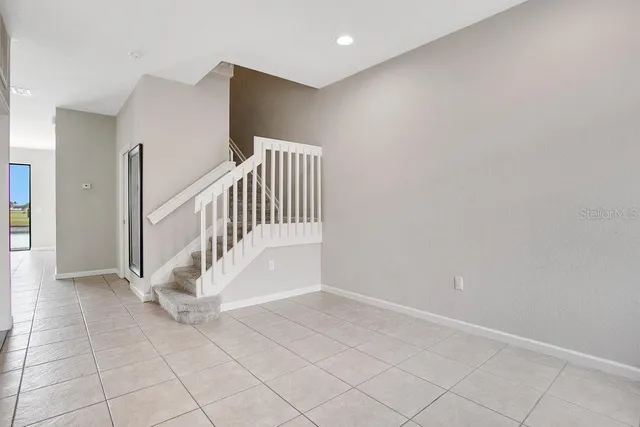 a view of entryway and hall with a window