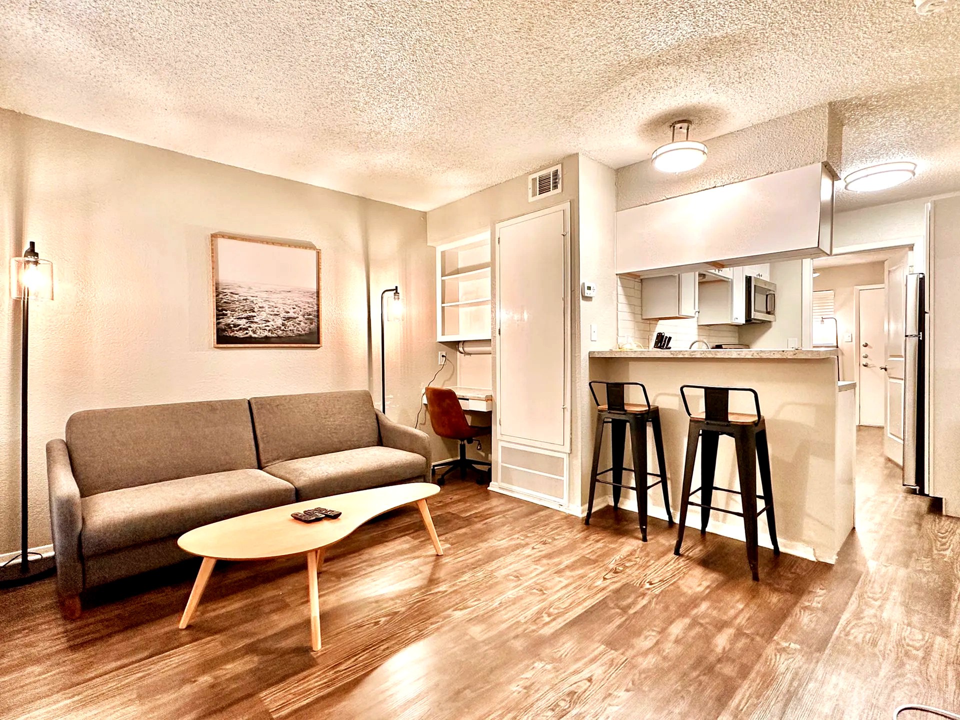 2808 Whitis Avenue, Unit C207 Austin, TX 78705 - Photo 1 of 5 a living room with furniture and a table